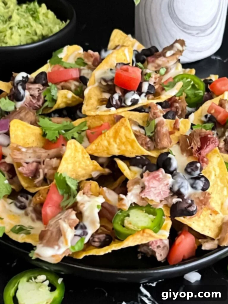 Smoky Pulled Pork Nachos 10 Pulled pork nachos with red onion, tomato, and jalapeno.