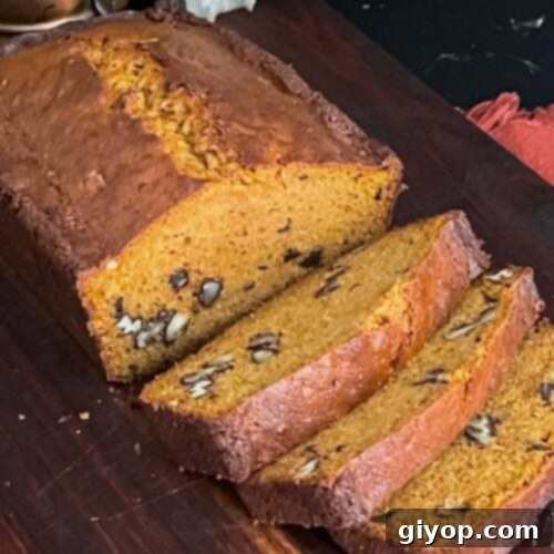 Sweet potato bread sliced on a wooden board.