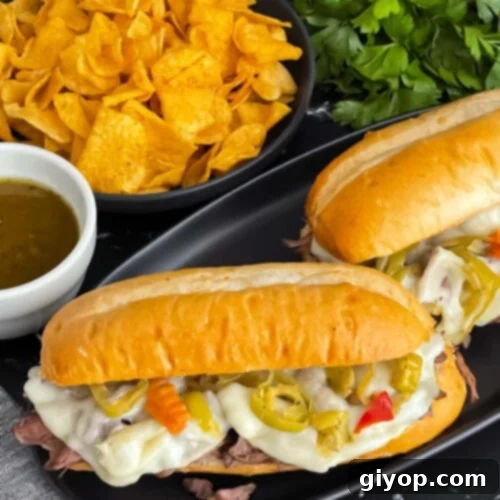 Italian beef sandwiches on a dark plate.
