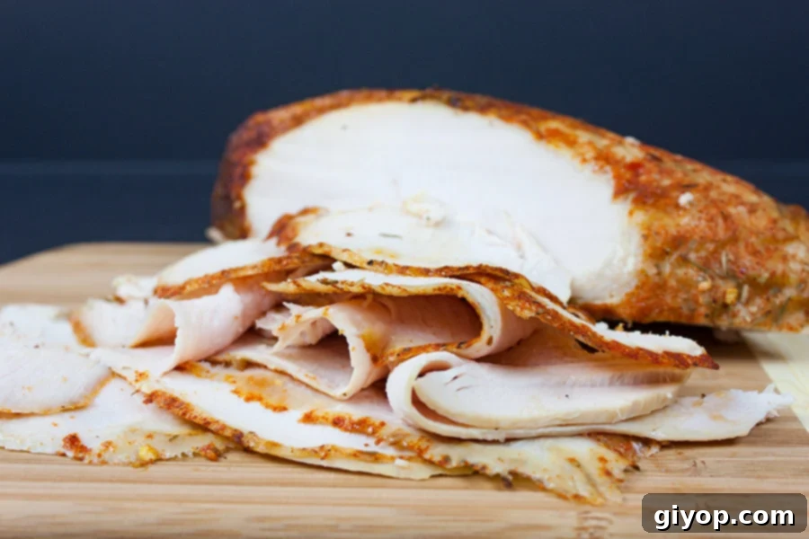 Artisan Cajun Turkey Deli Slices 6 Homemade Cajun Turkey Deli Meat sliced thin on a wooden cutting board