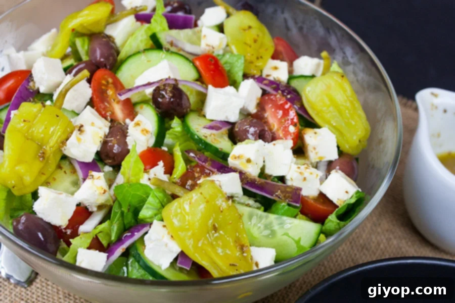 Homemade Greek Salad served in glass bowl, ready to eat.