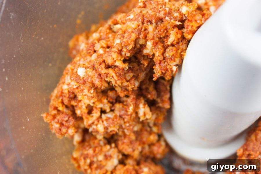 Smoky Bacon Glazed Chicken Kebabs 3 Raw bacon and spices processed into a smooth bacon paste in a food processor bowl.