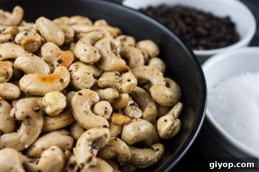 Salt and Pepper Roasted Cashews in a dark bowl.